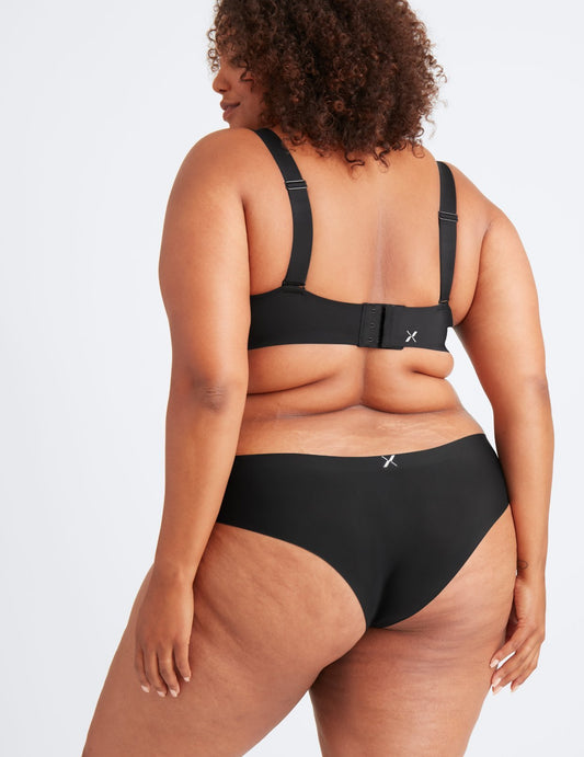 Brittnee's hips are 48”. She’s wearing size XXL underwear. Her bra is the Padded V-Neck Bra.